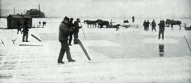 Workers sawing ice
